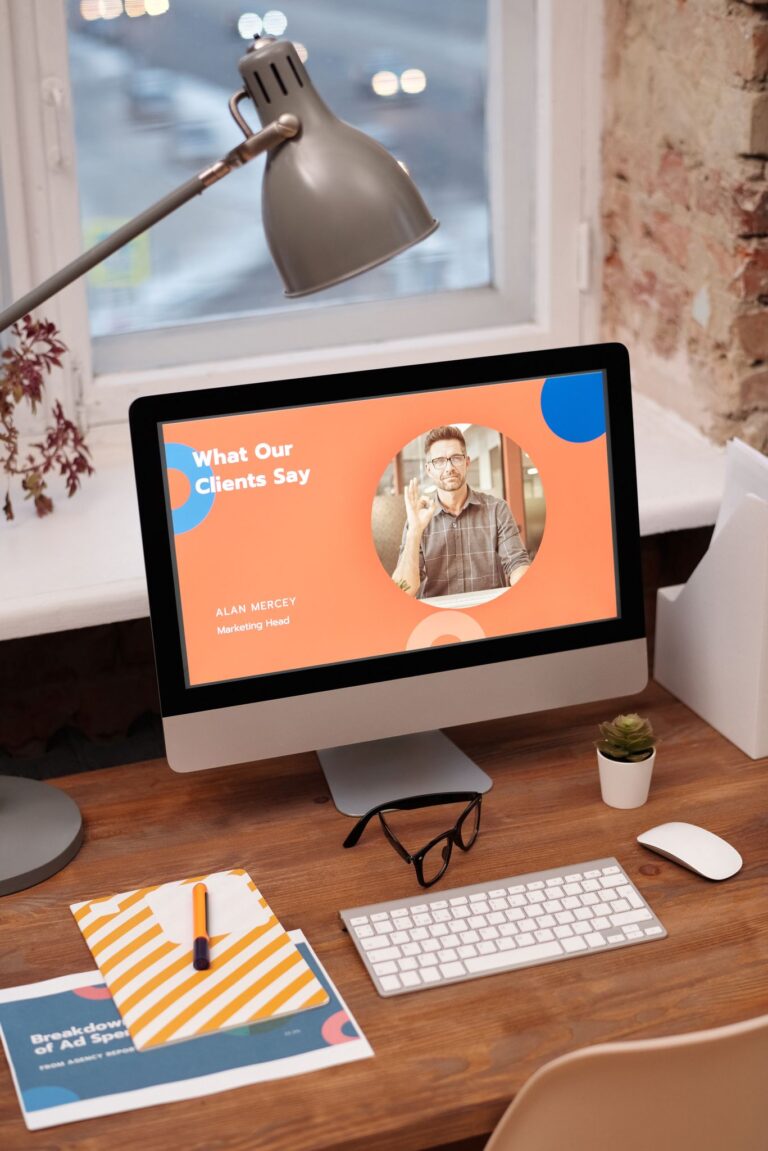 Stylish home office setup with computer showcasing client testimonials.